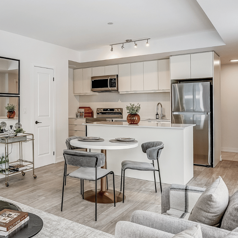 Staged dining room and kitchen at The Towns at York Mills & Leslie.